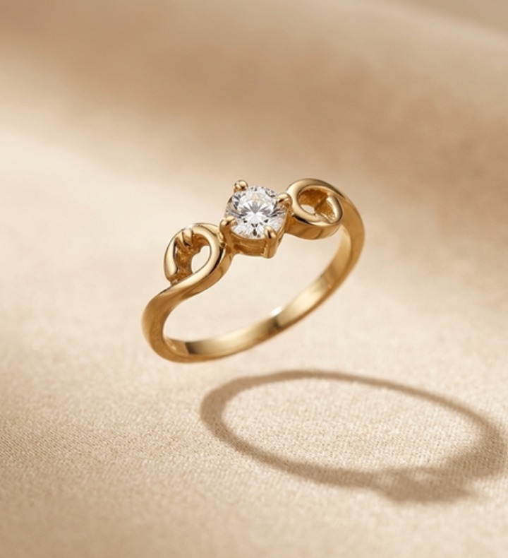 Gold engagement ring with a round solitaire diamond